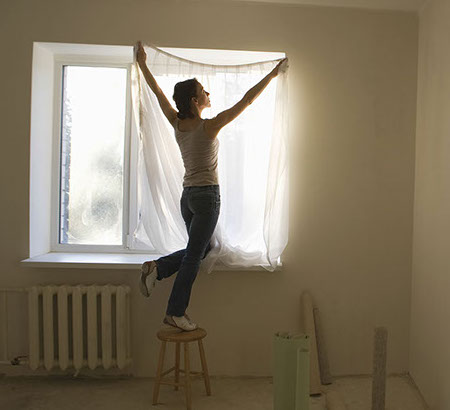 residential - girl hanging curtian