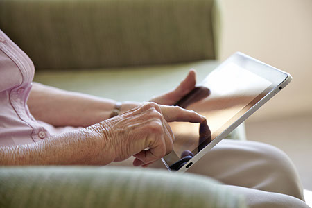 senior - touching tablet